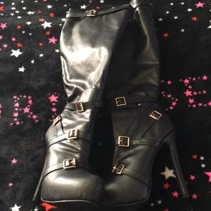 Over the knee heeled shoes